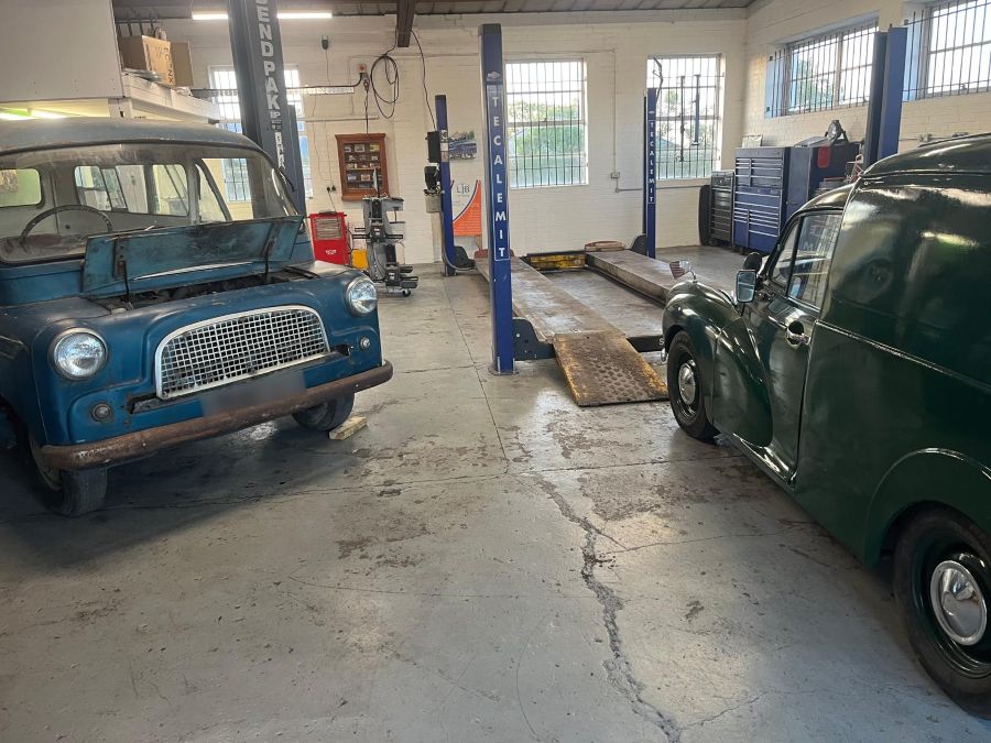 Lee Botting's classic van in the Pear Tree workshop, with his Morris Minor van beside it
